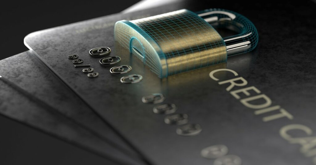 Lock on top of a credit card to symbolize encryption and how it defends against threats. 