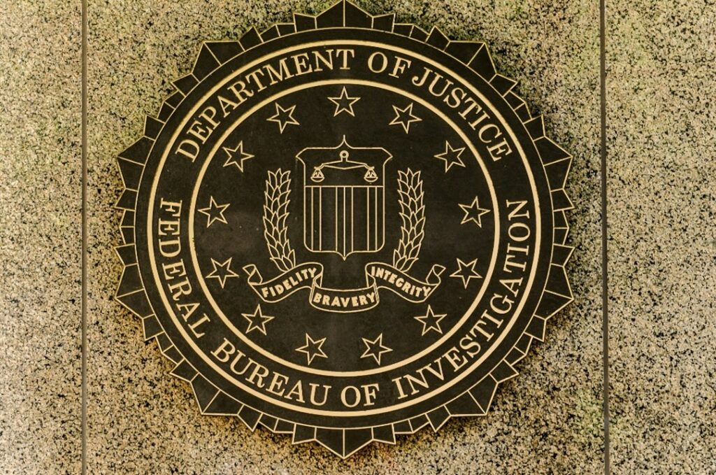 Photo of the FBI emblem. The law allows the FBI to legally obtain encrypted data.